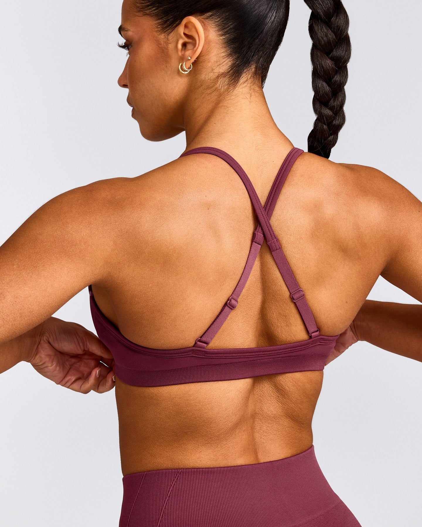 EnhanceLift™ Seamless Strappy Sports Bra with Grey Logo | Burnt Maroon Red