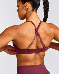 EnhanceLift™ Seamless Strappy Sports Bra with Grey Logo | Burnt Maroon Red