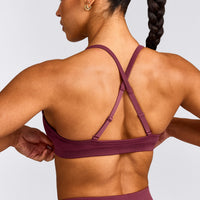 EnhanceLift™ Seamless Strappy Sports Bra with Grey Logo | Burnt Maroon Red