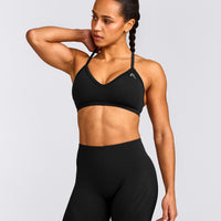EnhanceLift™ Seamless Strappy Sports Bra with Grey Logo | Black
