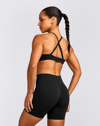 EnhanceLift™ Seamless Strappy Sports Bra with Grey Logo | Black