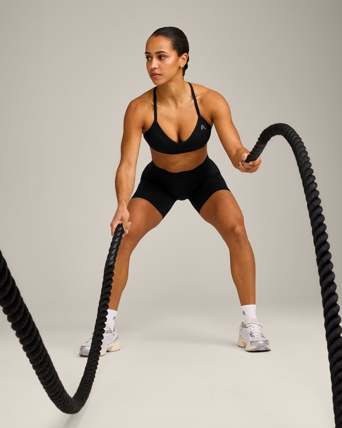 EnhanceLift™ Seamless Strappy Sports Bra with Grey Logo | Black