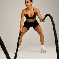 EnhanceLift™ Seamless Strappy Sports Bra with Grey Logo | Black