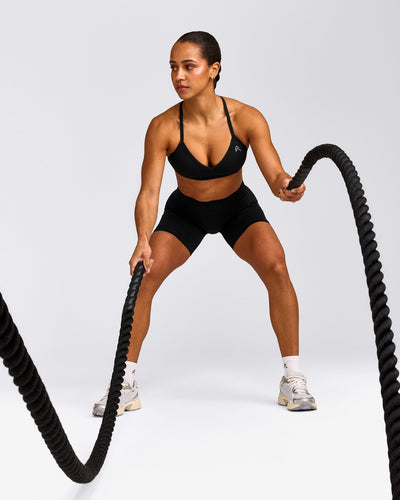 EnhanceLift™ Seamless Strappy Sports Bra with Grey Logo | Black