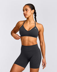 EnhanceLift™ Seamless Strappy Sports Bra with Grey Logo | Coal