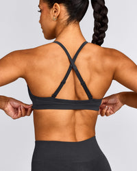 EnhanceLift™ Seamless Strappy Sports Bra with Grey Logo | Coal