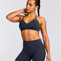 EnhanceLift™ Seamless Strappy Sports Bra with Grey Logo | True Blue