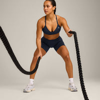 EnhanceLift™ Seamless Strappy Sports Bra with Grey Logo | True Blue
