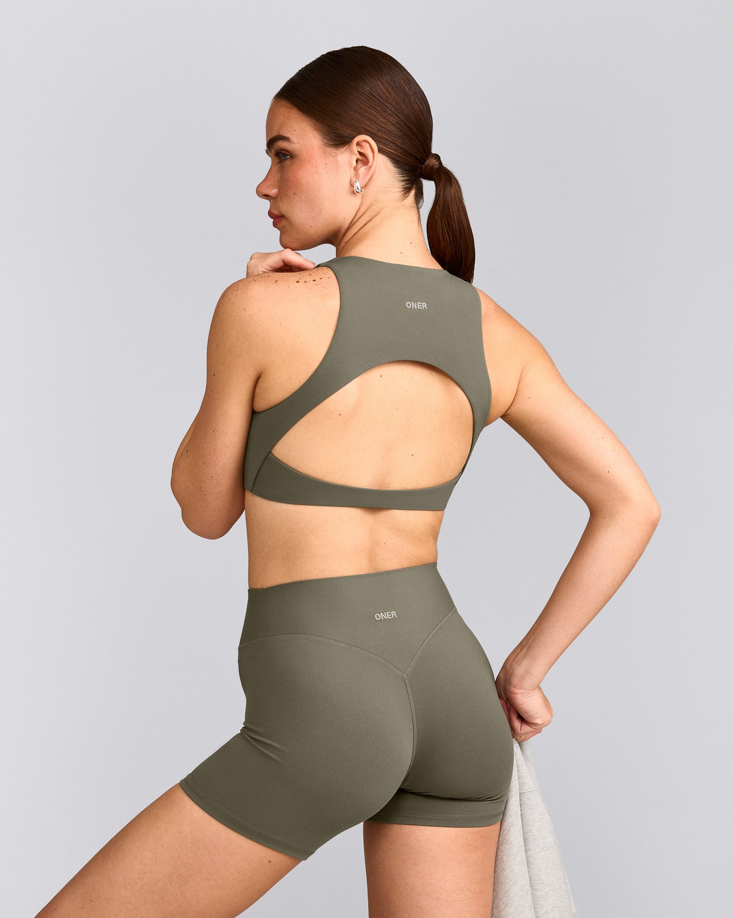 SoftMotion™ High Neck Sports Bra with Grey Logo | Alpine Green