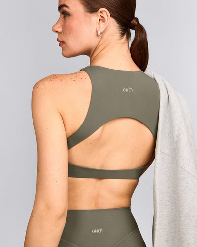 SoftMotion™ High Neck Sports Bra with Grey Logo | Alpine Green