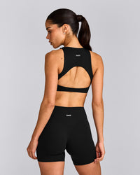SoftMotion™ High Neck Sports Bra with Grey Logo | Black