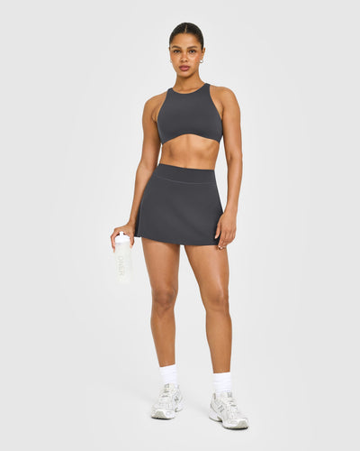 SoftMotion™ High Neck Sports Bra with White Logo | Coal
