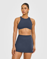 SoftMotion™ High Neck Sports Bra with White Logo | True Blue