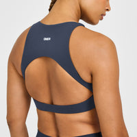 SoftMotion™ High Neck Sports Bra with White Logo | True Blue