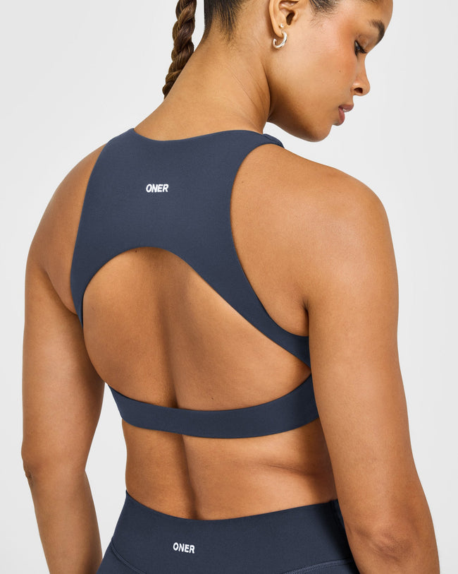 SoftMotion™ High Neck Sports Bra with White Logo | True Blue