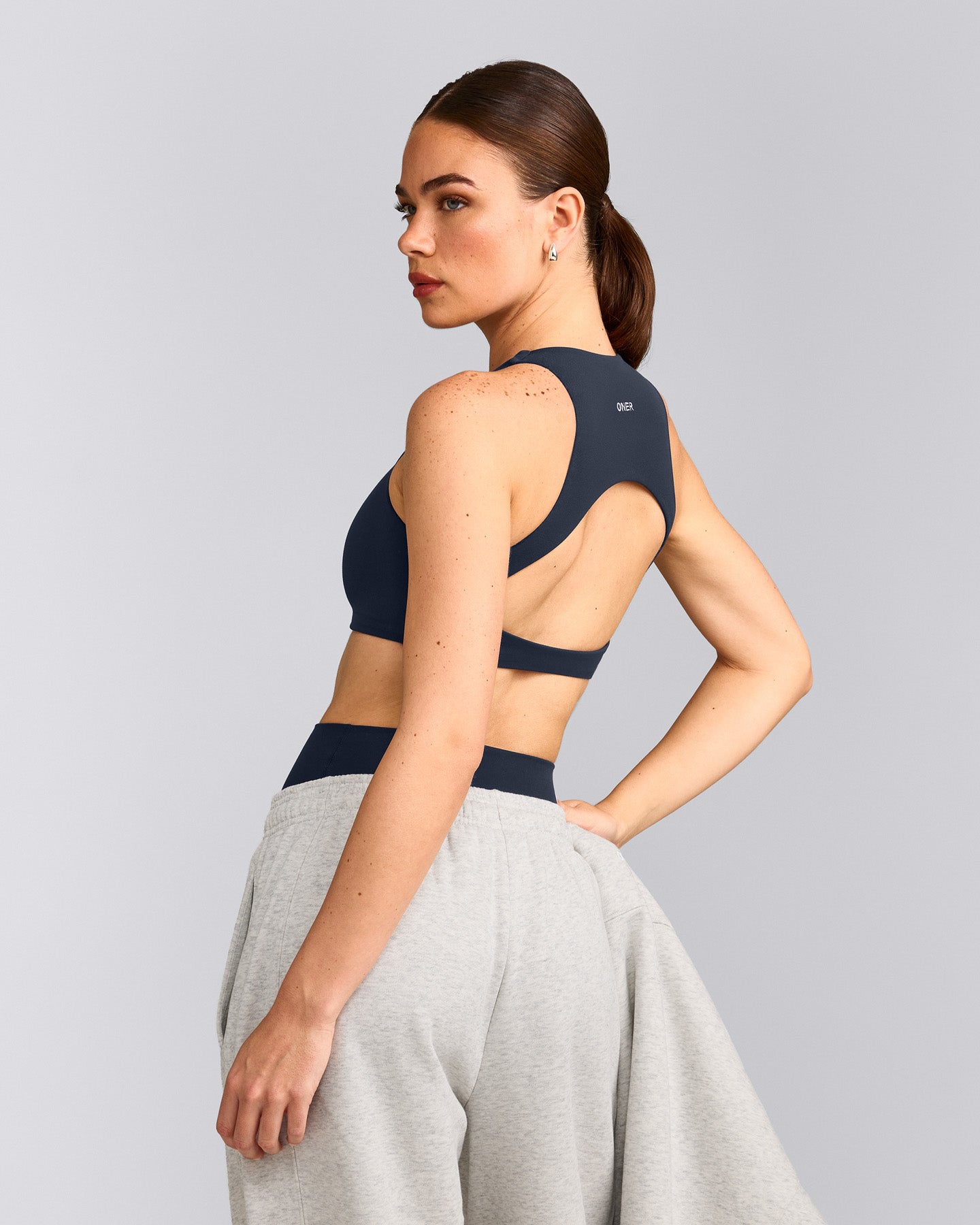SoftMotion™ High Neck Sports Bra with Grey Logo | True Blue