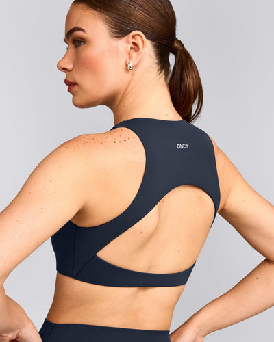 SoftMotion™ High Neck Sports Bra with Grey Logo | True Blue