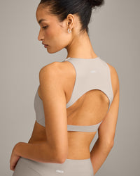 SoftMotion™ High Neck Sports Bra with White Logo | Warm Sand