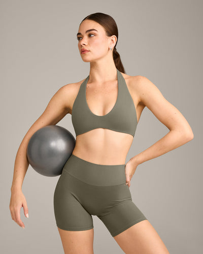 SoftMotion™ Minimal Halter Neck Bralette with Grey Logo | Alpine Green