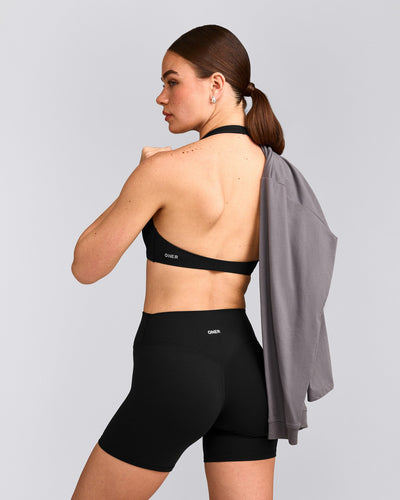 SoftMotion™ Minimal Halter Neck Bralette with Grey Logo | Black