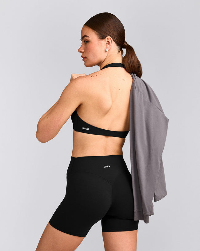 SoftMotion™ Minimal Halter Neck Bralette with Grey Logo | Black