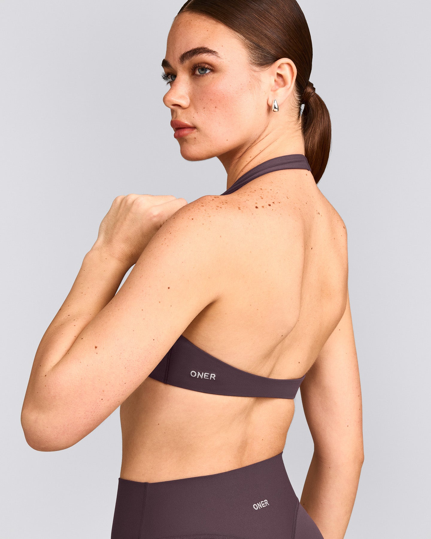 SoftMotion™ Minimal Halter Neck Bralette with Grey Logo | Dark Umber Brown