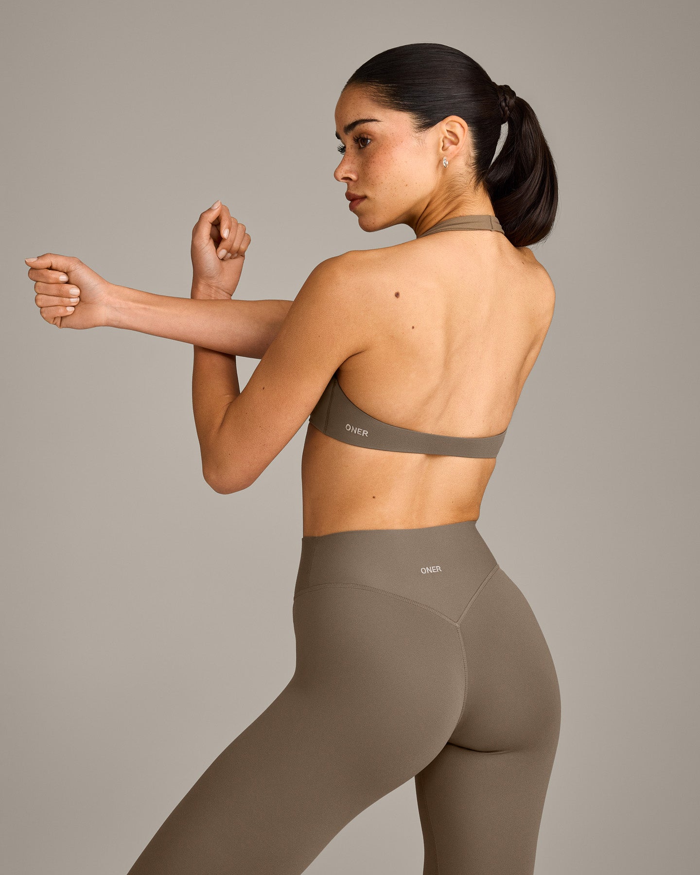 SoftMotion™ Minimal Halter Neck Bralette with Grey Logo | Moss Brown