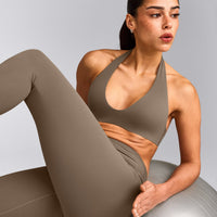 SoftMotion™ Minimal Halter Neck Bralette with Grey Logo | Moss Brown