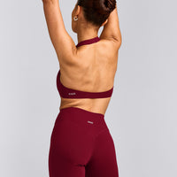 SoftMotion™ Minimal Halter Neck Bralette with Grey Logo | Ruby Red