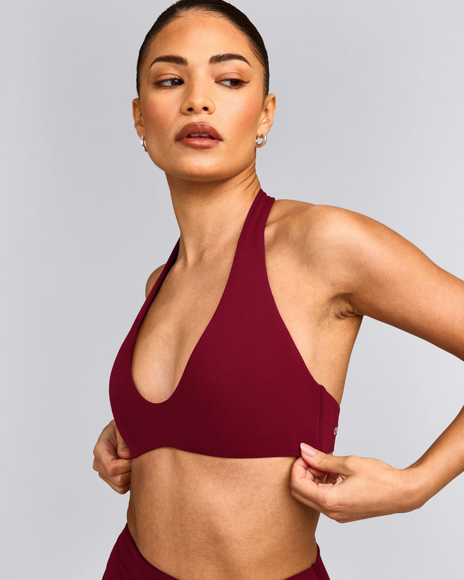SoftMotion™ Minimal Halter Neck Bralette with Grey Logo | Ruby Red