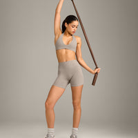 SoftMotion™ Minimal Halter Neck Bralette with White Logo | Warm Sand