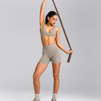SoftMotion™ Minimal Halter Neck Bralette with White Logo | Warm Sand