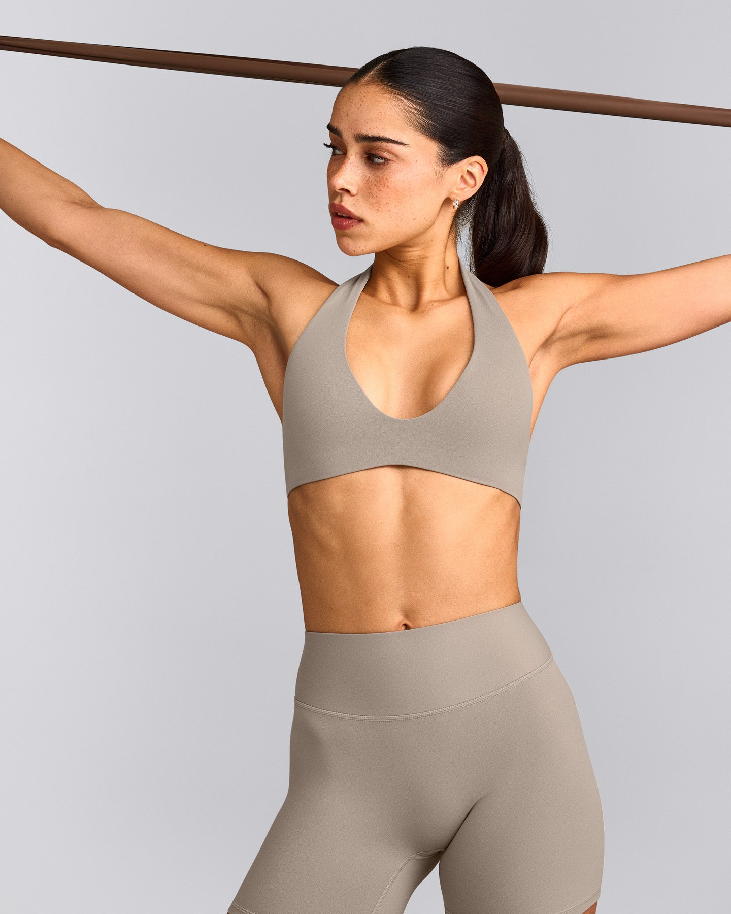 SoftMotion™ Minimal Halter Neck Bralette with White Logo | Warm Sand