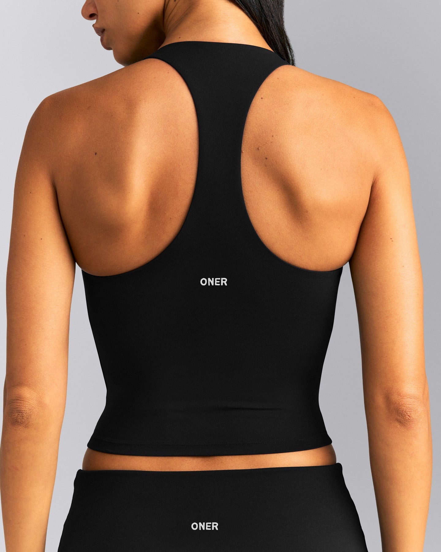 SoftMotion™ Racer Back Mid Tank Top with Built in Bra Shelf New Branding | Black