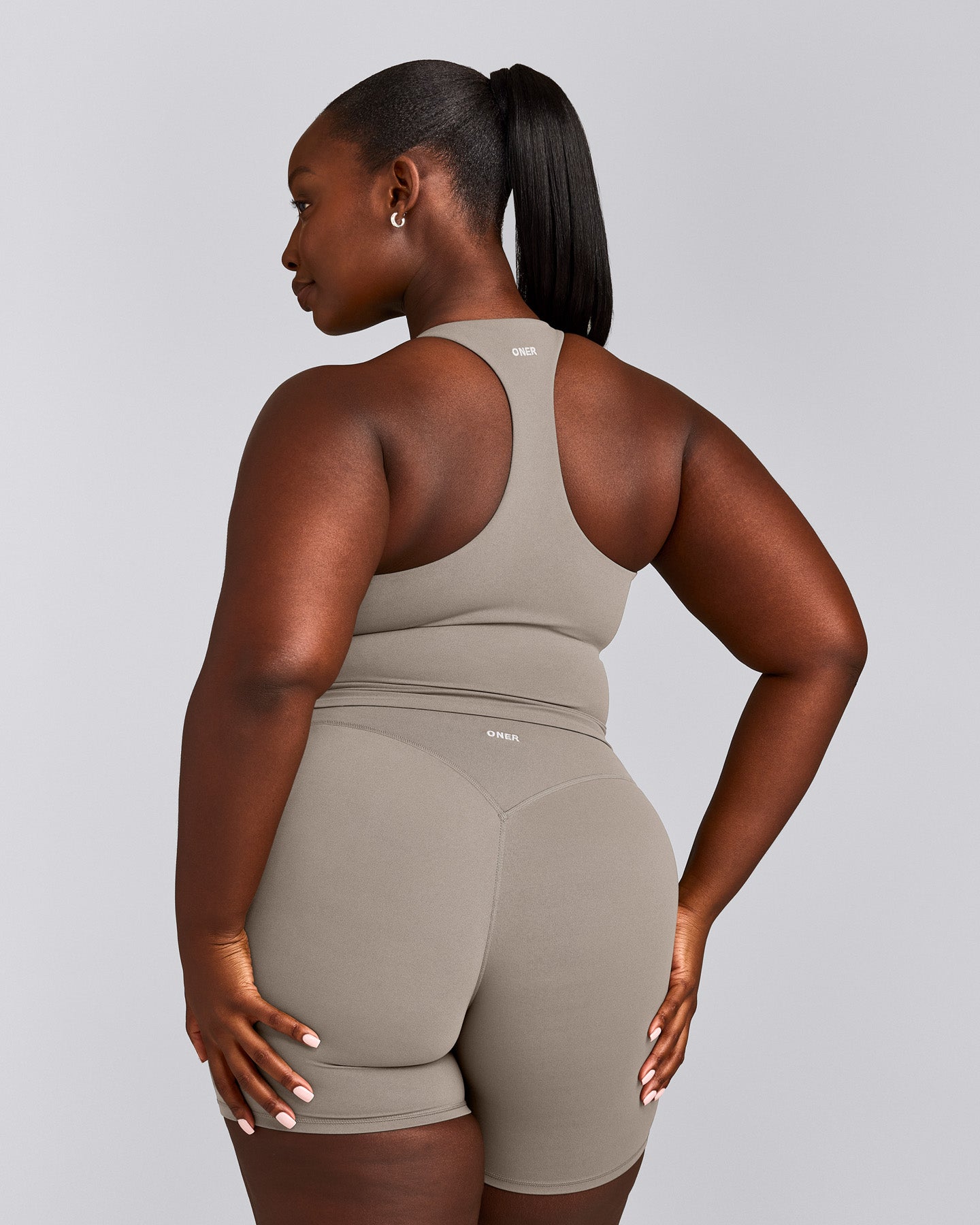 SoftMotion™ Racer Back Mid Vest with Built in Bra Shelf with White Logo | Warm Sand