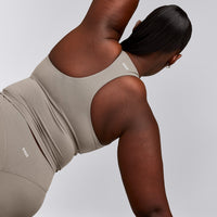 SoftMotion™ Racer Back Mid Vest with Built in Bra Shelf with White Logo | Warm Sand