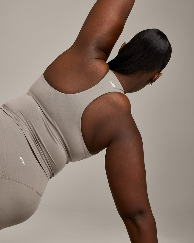 SoftMotion™ Racer Back Mid Vest with Built in Bra Shelf with White Logo | Warm Sand