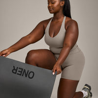 SoftMotion™ Racer Back Mid Vest with Built in Bra Shelf with White Logo | Warm Sand