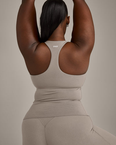 SoftMotion™ Racer Back Vest with Built in Bra Shelf with White Logo | Warm Sand