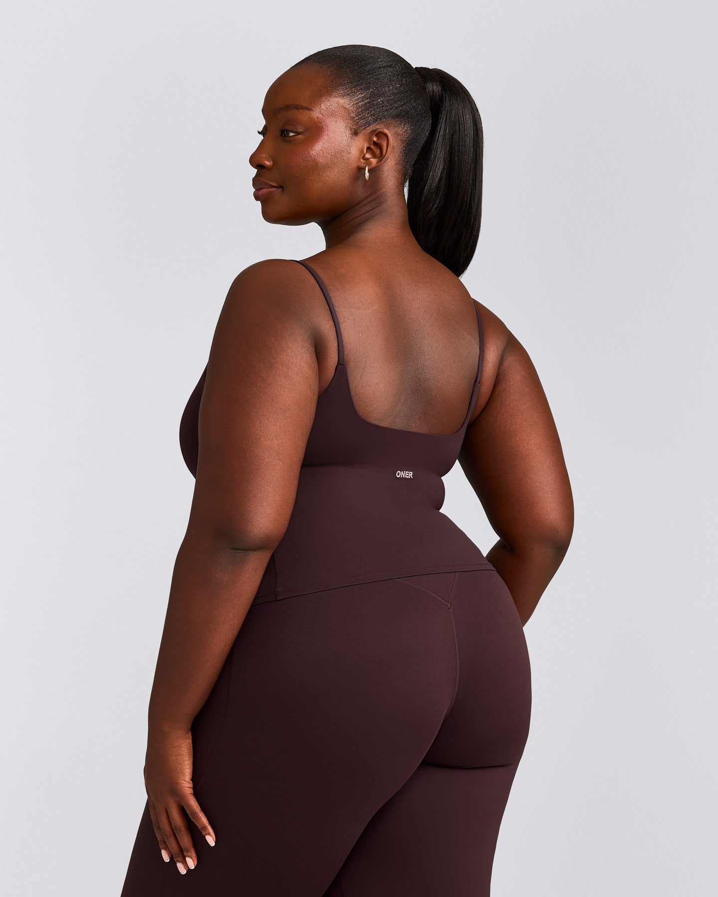 SoftMotion™ Strappy Mid Vest with Built in Bra Shelf with Grey Logo | Plum Brown