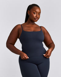 SoftMotion™ Strappy Mid Vest with Built in Bra Shelf with Grey Logo | True Blue