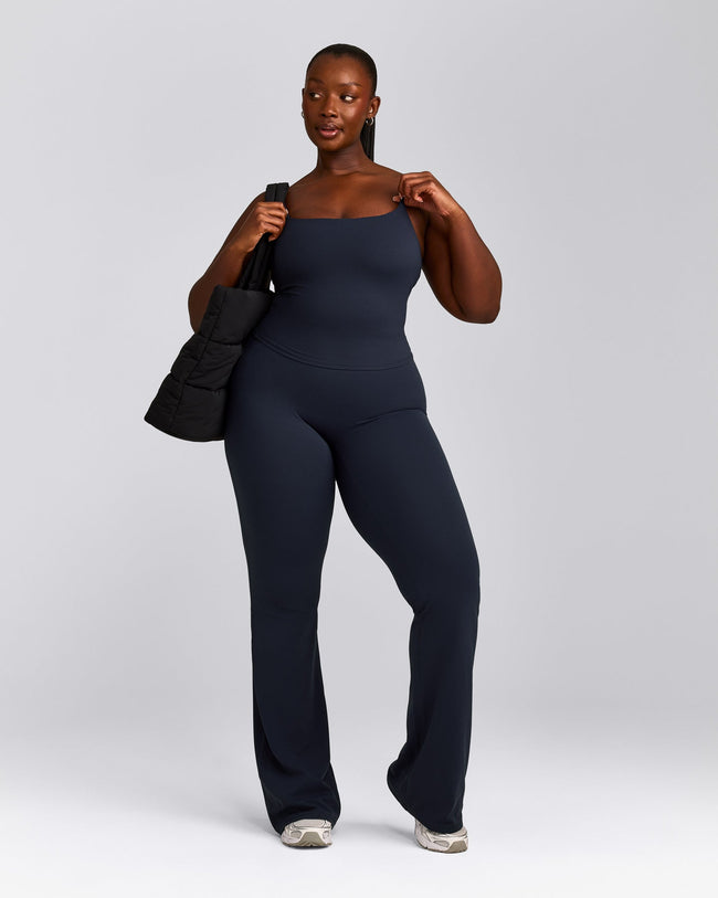 SoftMotion™ Strappy Mid Vest with Built in Bra Shelf with Grey Logo | True Blue