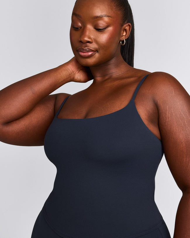 SoftMotion™ Strappy Mid Vest with Built in Bra Shelf with Grey Logo | True Blue