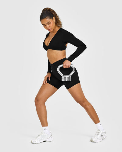 Unified Twist Front Long Sleeve Crop Top White Logo | Black