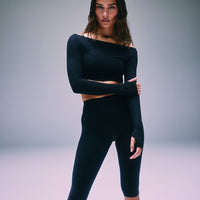 SoftMotion™ High Waisted Capri Leggings with Grey Logo | Black