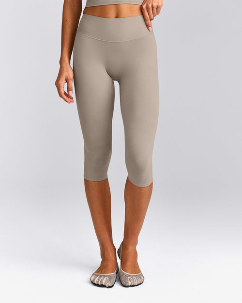SoftMotion™ High Waisted Capri Leggings with White Logo | Warm Sand