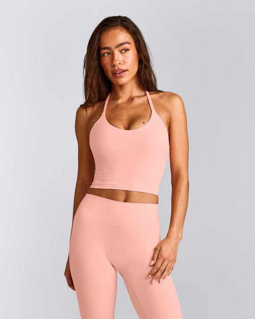 SoftMotion™ Strappy Halter Neck Mid Vest with Built in Bra Shelf with Grey Logo | Peach Orange