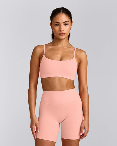 SoftMotion™ Strappy Sports Bra with Grey Logo | Peach Orange