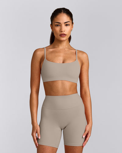 SoftMotion™ Strappy Sports Bra with White Logo | Warm Sand