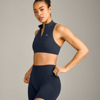 EasyLift™ Zip High Neck Sports Bra with Grey Logo | True Blue